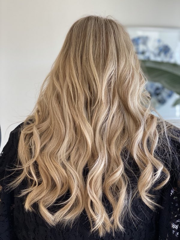 Beachy blonde styling with soft curls